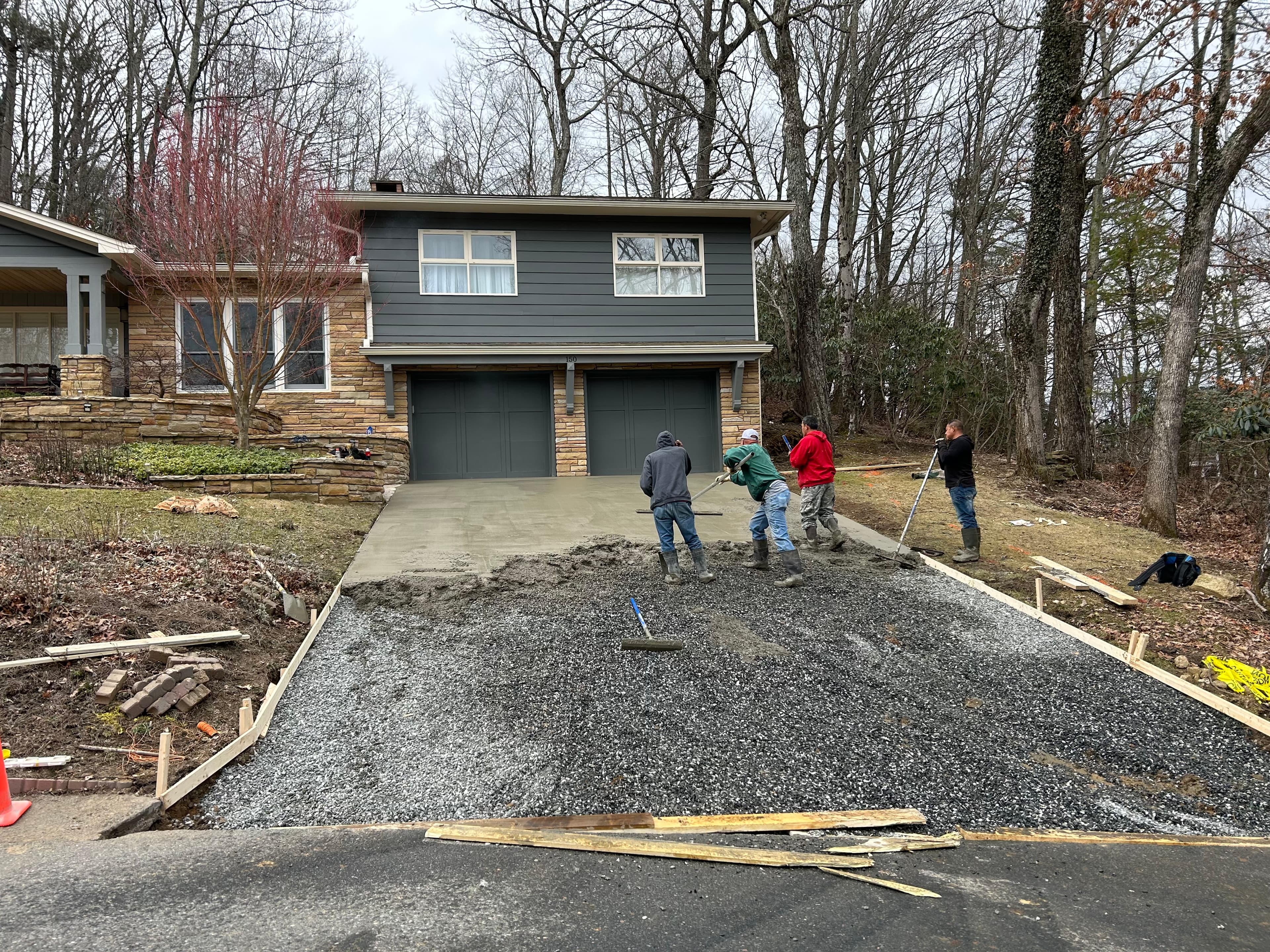 Residential driveway project during the pour and finish process