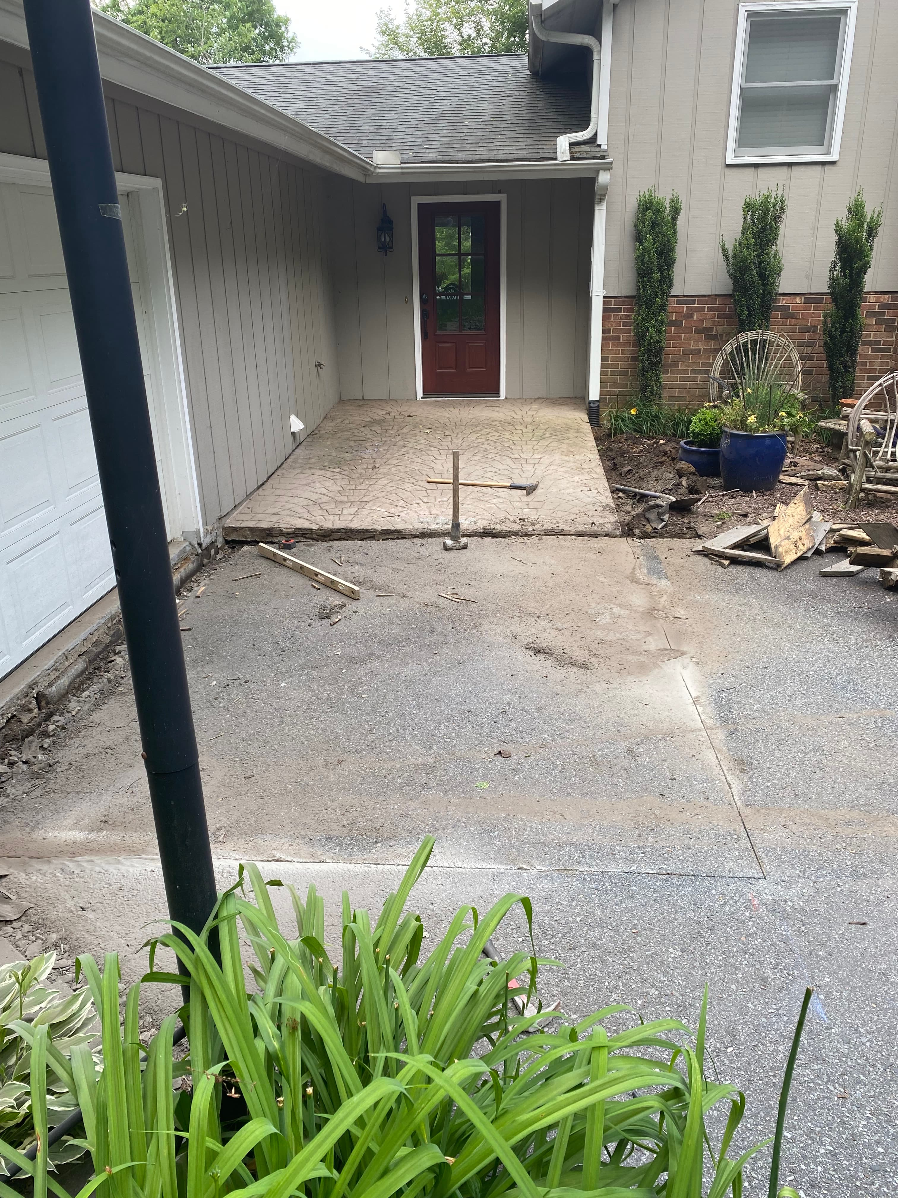 Before photo of a driveway and entry concrete project